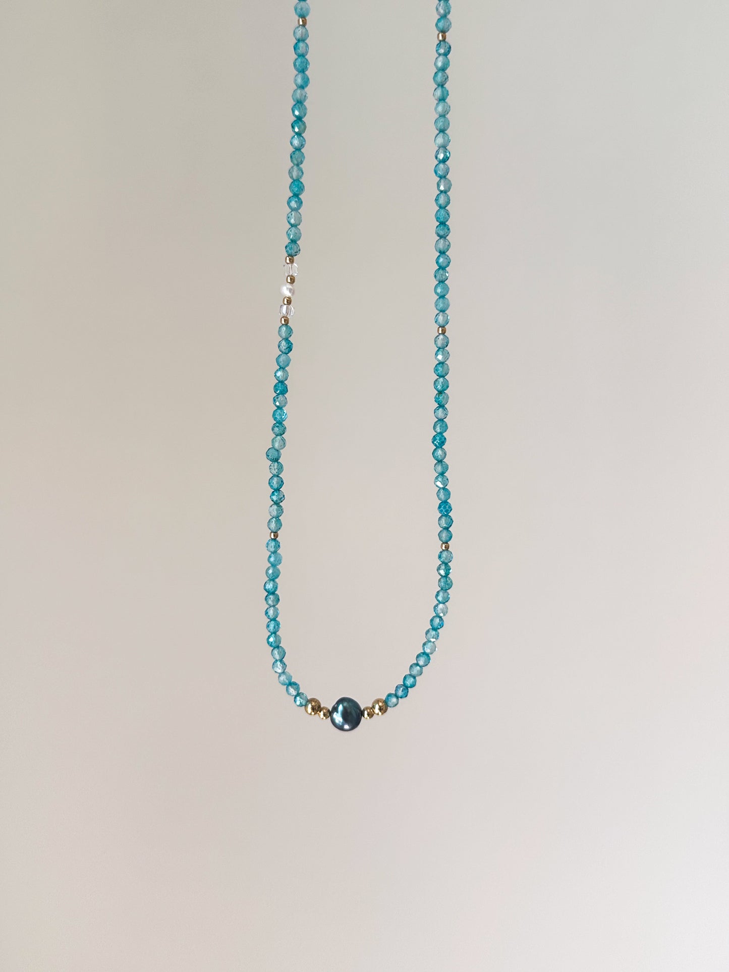 Blue Topaz with a Black Freshwater Pearl