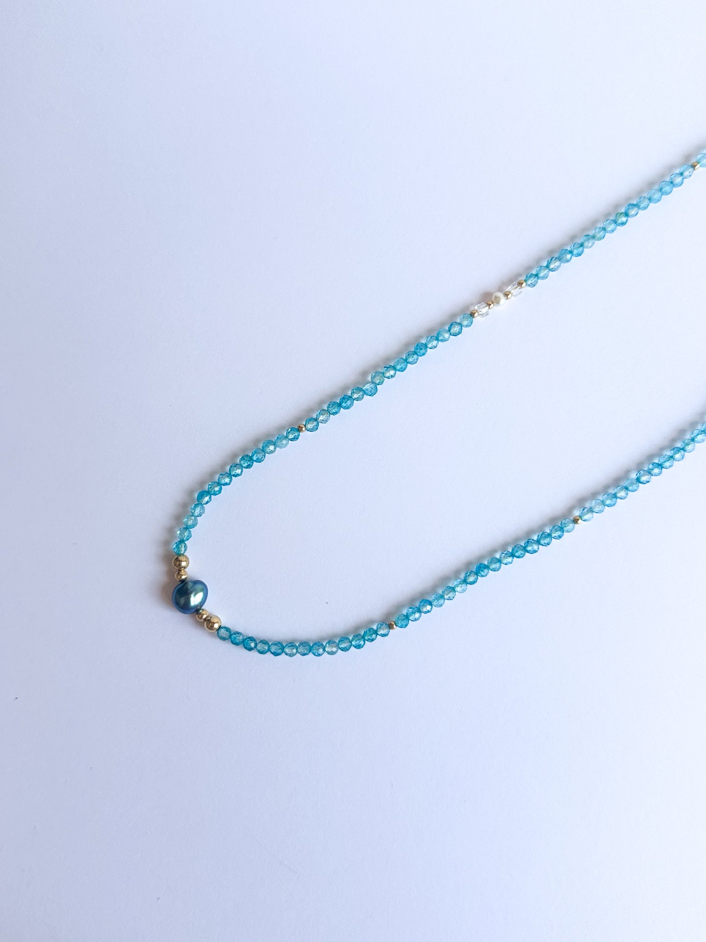 Blue Topaz with a Black Freshwater Pearl