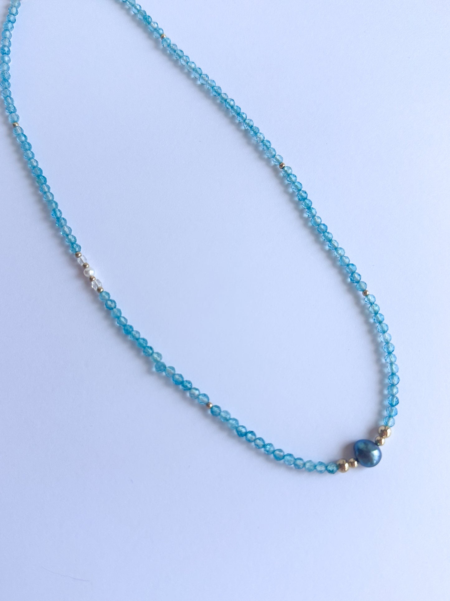 Blue Topaz with a Black Freshwater Pearl