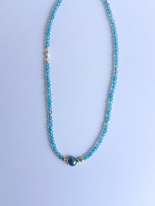 Blue Topaz with a Black Freshwater Pearl